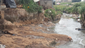 Sewage drains from pit latrines directly into the Motoine River in Kibera, Kenya. Photo: Nicholas Kiulia.